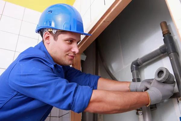 Expert Plumbers Installing Central Air Conditioning Systems